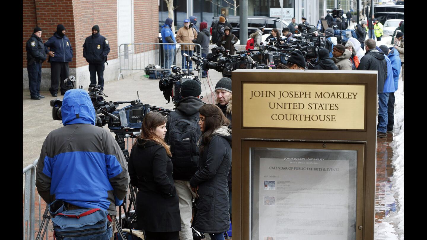 Members of the media wait outside federal court, Wednesday, March 4, 2015, in Boston, on the first day of the federal death penalty trial of Boston Marathon bombing suspect Dzhokhar Tsarnaev.
