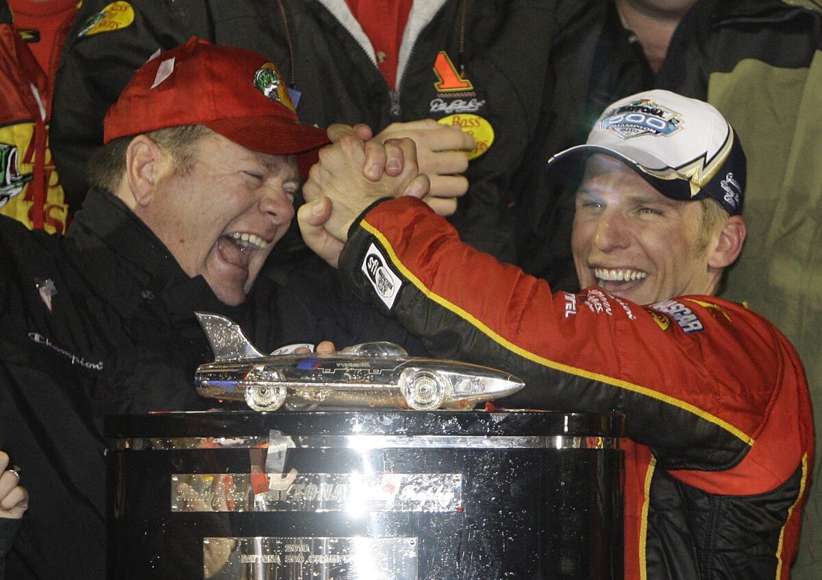 FILE - Team owner Chip Ganassi, left, and driver Jamie McMurray celebrate in Victory Lane after McMurray won the Daytona 500 NASCAR auto race at Daytona International Speedway in Daytona Beach, Fla., Sunday, Feb. 14, 2010. Chip Ganassi will close his 20-year run in NASCAR in Sunday’s, Nov. 7, 2021, season finale. (AP Photo/John Raoux, File)