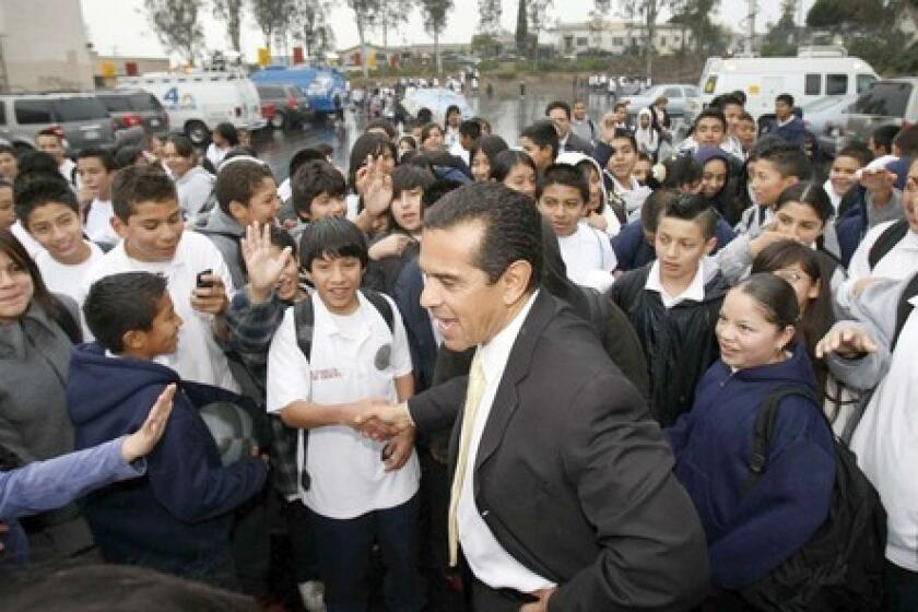 Students at Hollenbeck Middle School in Los Angeles greet Mayor Antonio Villaraigosa the day after he was elected to a second term as mayor. He was meeting with parents to discuss his education goals.