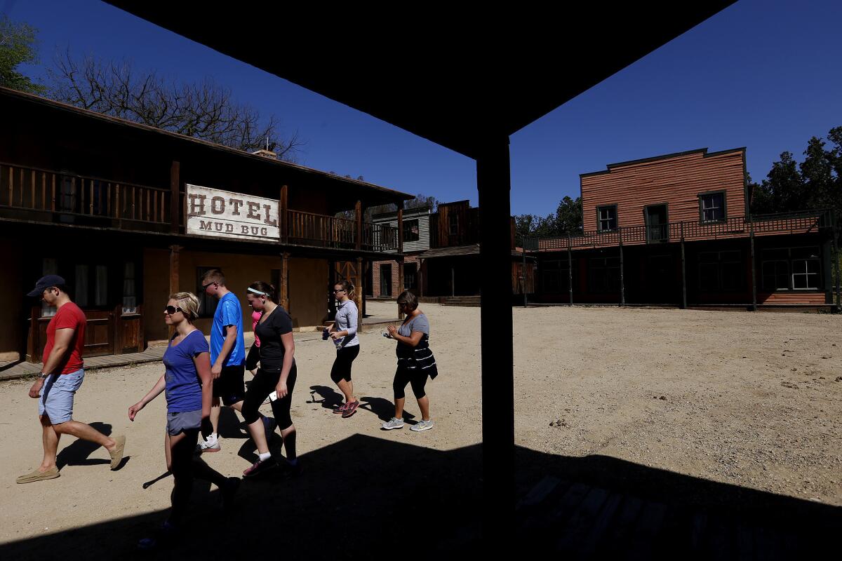 Visitors walk through the old Western Town set at Paramount Ranch in Agoura Hills in 2015.