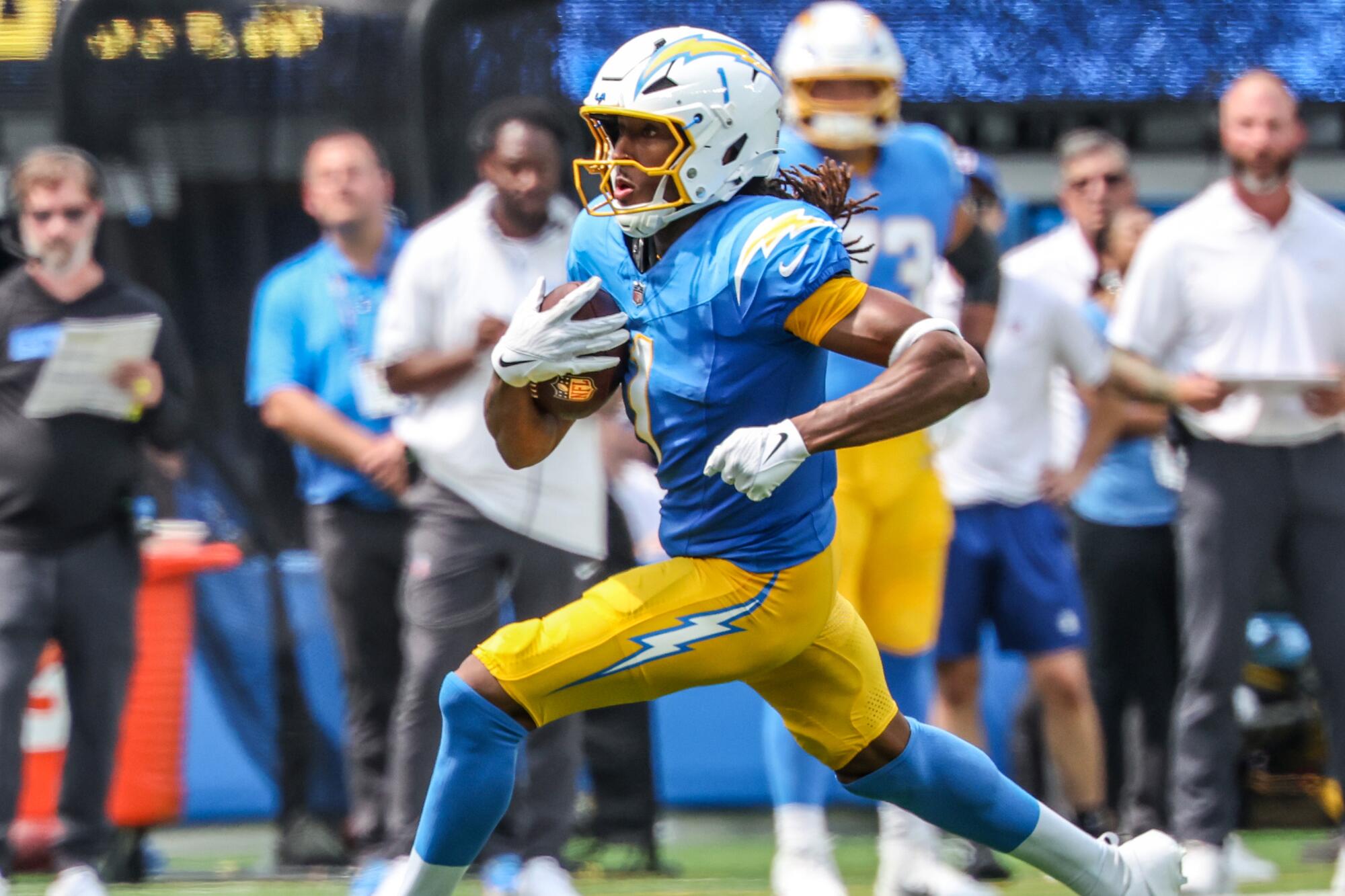 Chargers wide receiver Quentin Johnston runs with the ball after making a catch against the Las Vegas Raiders.