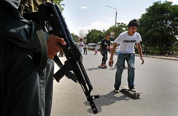 Skateboarders take over the streets of Kabul, Afghanistan, under vigilant security. Australian Oliver Percovich has been teaching local kids to skate since 2007, and now his nonprofit Skateistan club is building an indoor skateboard park in the city.