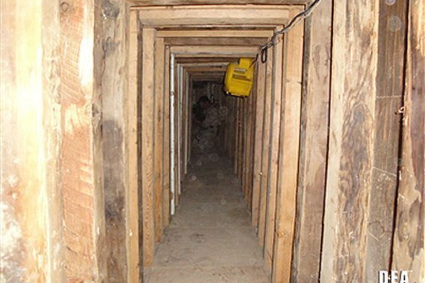 In this undated photo provided by the United States Drug Enforcement Administration, shows a 240-yard, a complete and fully operational drug smuggling tunnel, from the U.S. side of the tunnerl, that ran from a small business in Arizona to an ice plant on the Mexico side of the border, Thursday, Jul