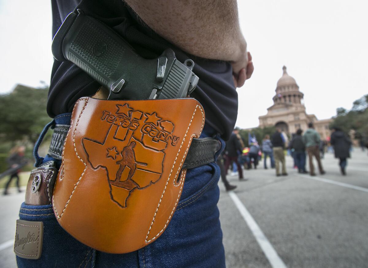 Terry Holcomb, executive director of Texas Carry, wearing his customized holster at the Capitol during a protest on Jan. 1.