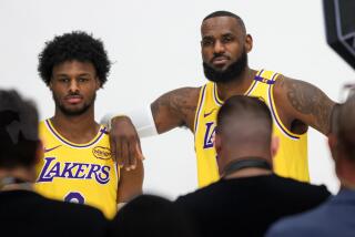 El Segundo, CA, Monday, September 30, 2024 - LeBron James poses for photos with his son, Bronny, left, for a as Lakers players attend media day at the UCLA Health Training Center. (Robert Gauthier/Los Angeles Times)