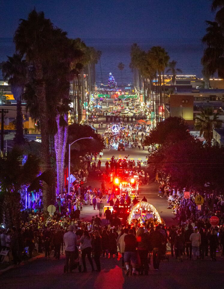 Newport Avenue lights up all the way to the sea for the Ocean Beach Holiday Parade on Dec. 4.