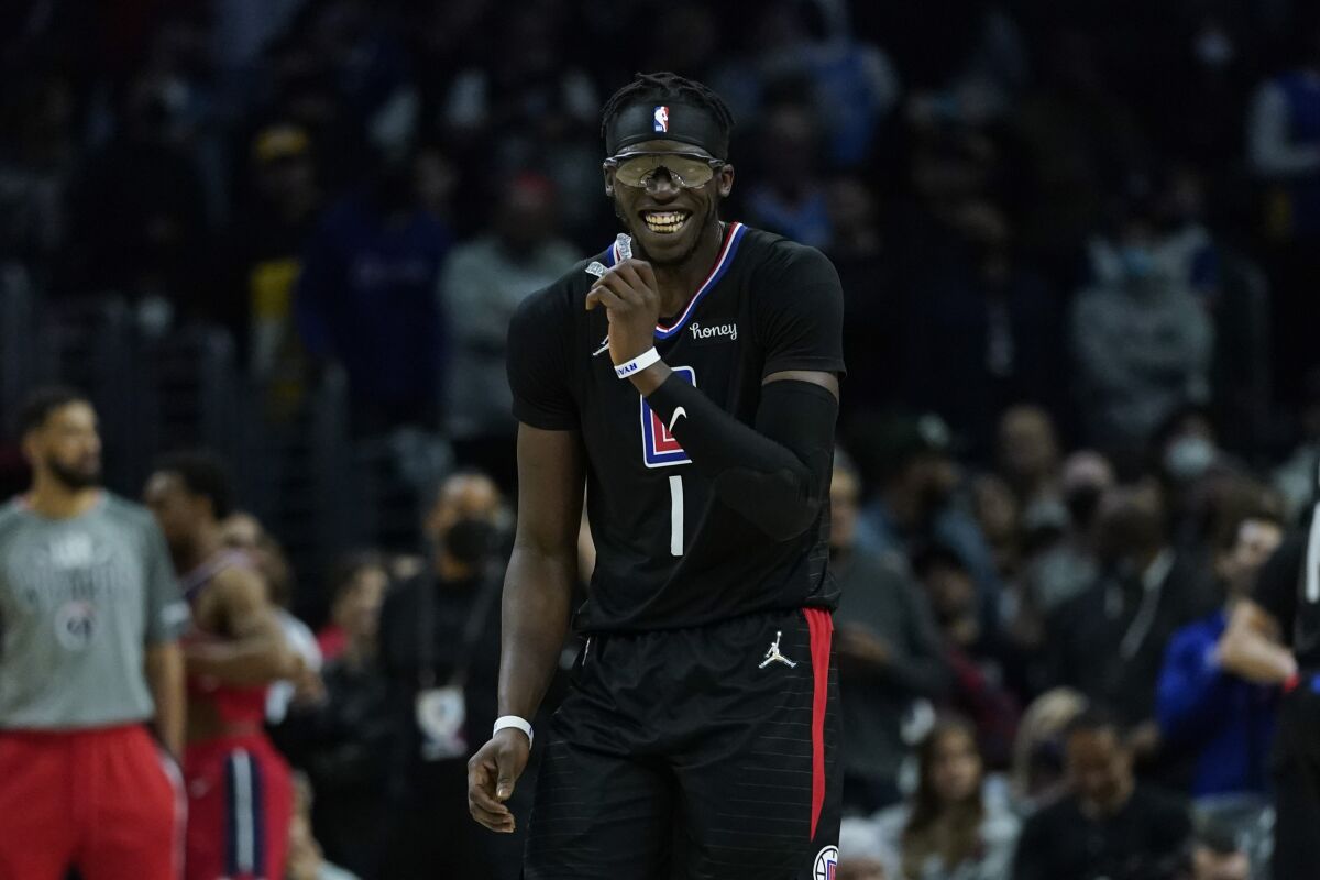 Los Angeles Clippers guard Reggie Jackson (1) reacts after a 115-109 win over the Washington Wizards in their NBA basketball game in Los Angeles, Wednesday, March 9, 2022. (AP Photo/Ashley Landis)