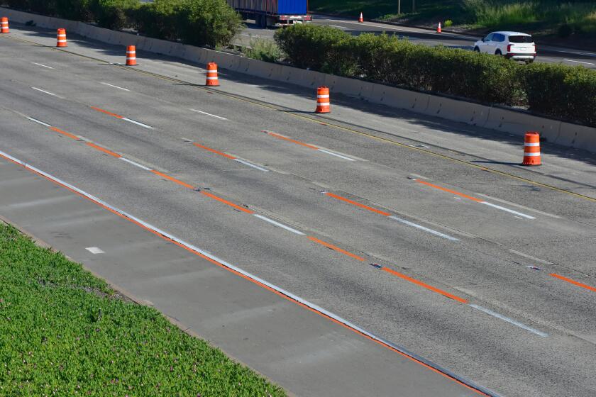 Newly laid orange striping on I-5, photo taken from the Cassidy Street Bridge