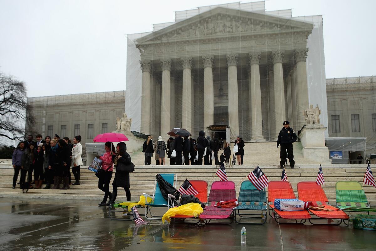 Demonstrators set up beach chairs in front of the U.S. Supreme Court in Washington, D.C., where dozens of people waited in line Monday for a chance to attend oral arguments Tuesday over the constitutionality of Proposition 8.