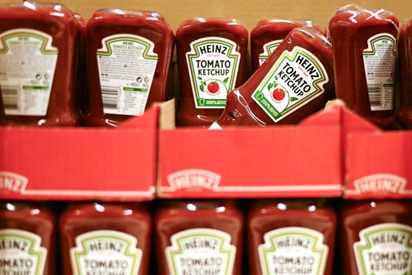 Bottles of The Kraft Heinz Co. ketchup in a supermarket.