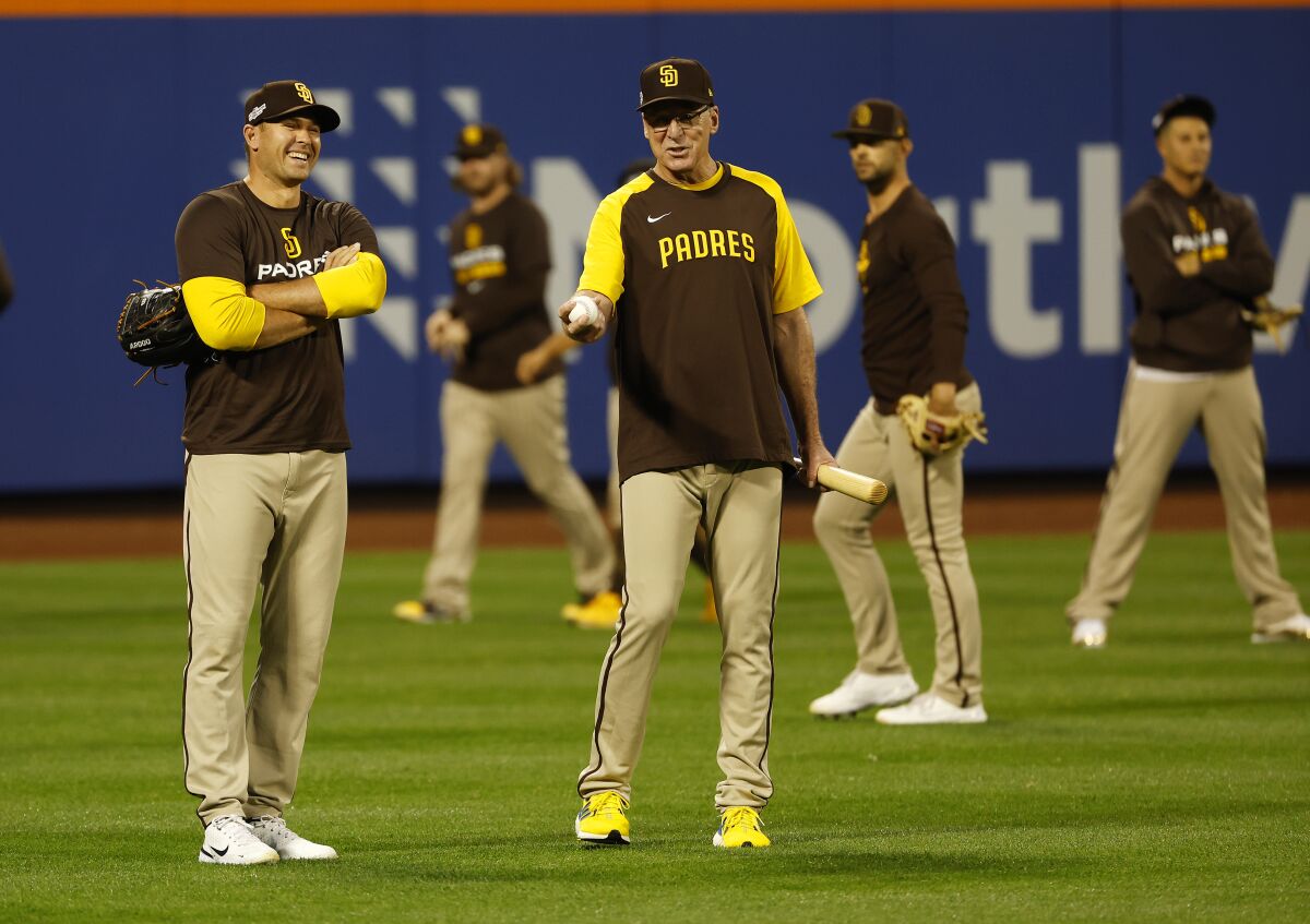 Padres pitcher Craig Stammenn and with manager Bob Melvin enjoy a moment during a workout at Citi Field