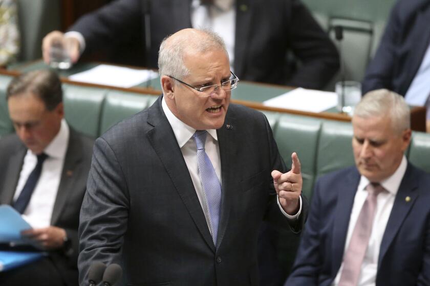 Prime Minister Scott Morrison speaks during Question time in Parliament in Canberra, Australia, on Tuesday, Feb. 11, 2020. (AP Photo/Rod McGuirk)