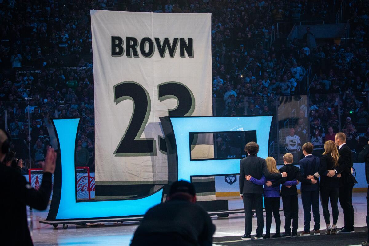 Dustin Brown's No. 23 jersey number is formally retired.