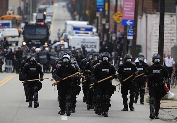 Police in riot gear in Pittsburgh prepare to confront demonstrators opposed to the Group of 20 economic summit.