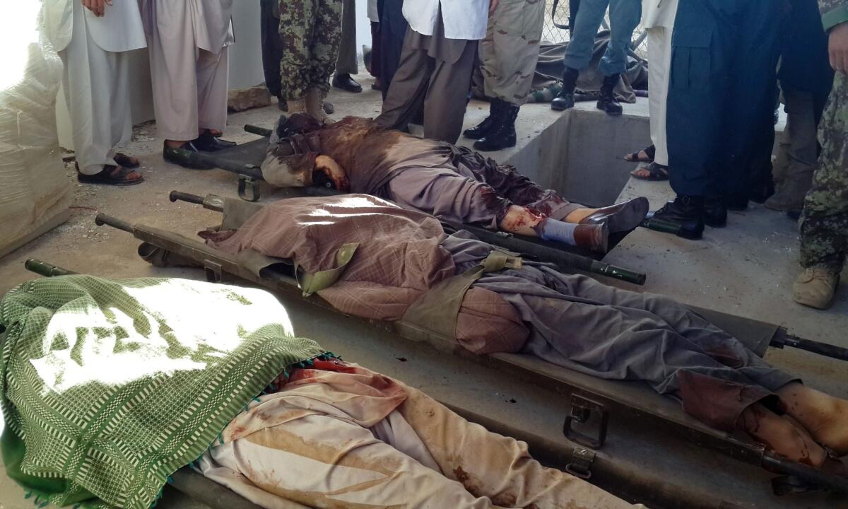 Bodies of Shiite Muslims shot to death after Taliban insurgents stopped their vehicles in Afghanistan's Ghor province on July 25.