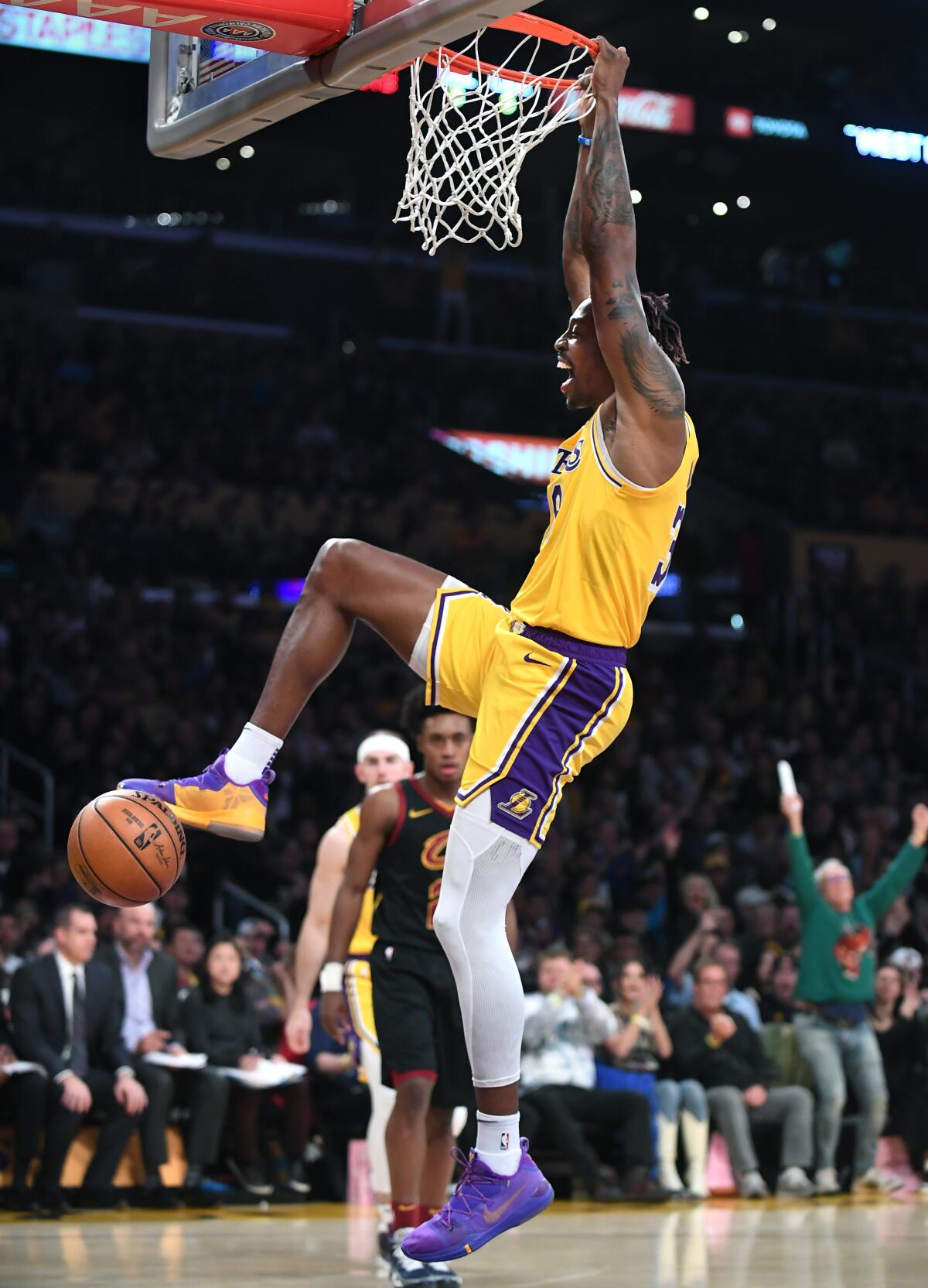 Dwight Howard dunks during the Lakers' win over the Cavaliers on Monday at Staples Center. He finished with season highs of 21 points and 15 rebounds.
