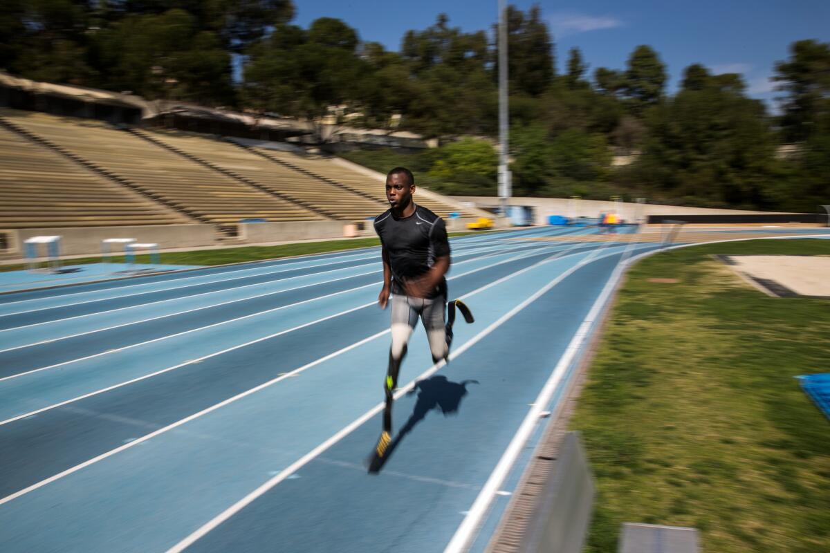 Paralympic sprinter Blake Leeper runs at the UCLA Drake Track Stadium.