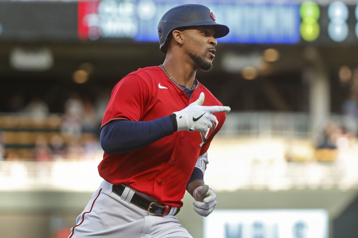 Minnesota Twins' Byron Buxton runs the bases on a solo home run against the Cleveland Guardians during the first inning of a baseball game Friday, May 13, 2022, in Minneapolis. (AP Photo/Bruce Kluckhohn)