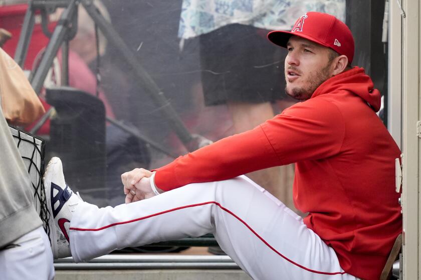 Angels center fielder Mike Trout sits in the dugout during a game against the Houston Astros on June 7