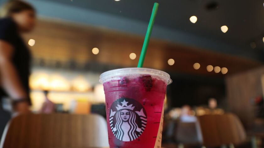 A plastic straw in a Starbucks drink.