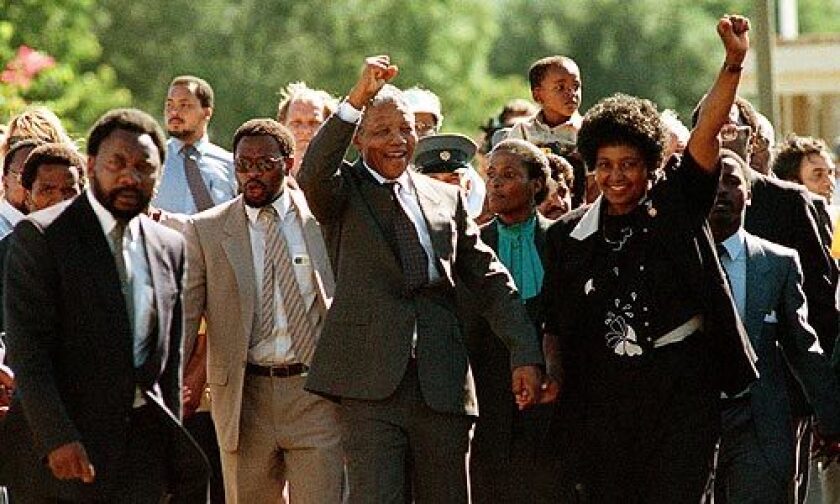 Nelson Mandela and wife Winnie greet cheering crowds outside Victor Verster prison in Paarl. Narrated slide show >>>
