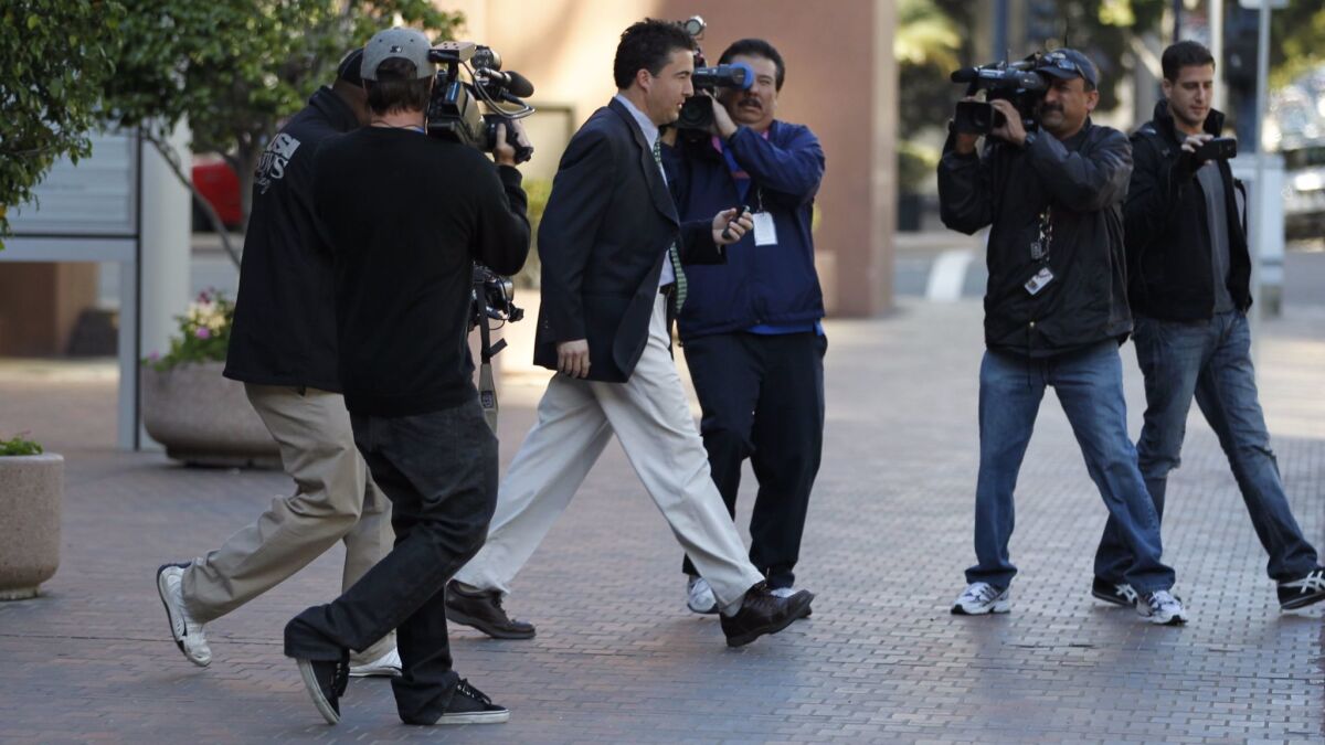 Former San Diego City Councilman Ralph Inzunza is shown leaving the federal courthouse in San Diego on Jan. 20, 2012 after being sentenced to prison for his involvement in "Strippergate." He has drawn on his life behind bars to write a newly released novel.