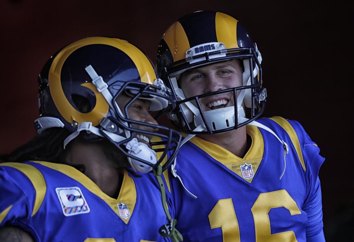 Todd Gurley, left, and Jared Goff share a laugh before a game.