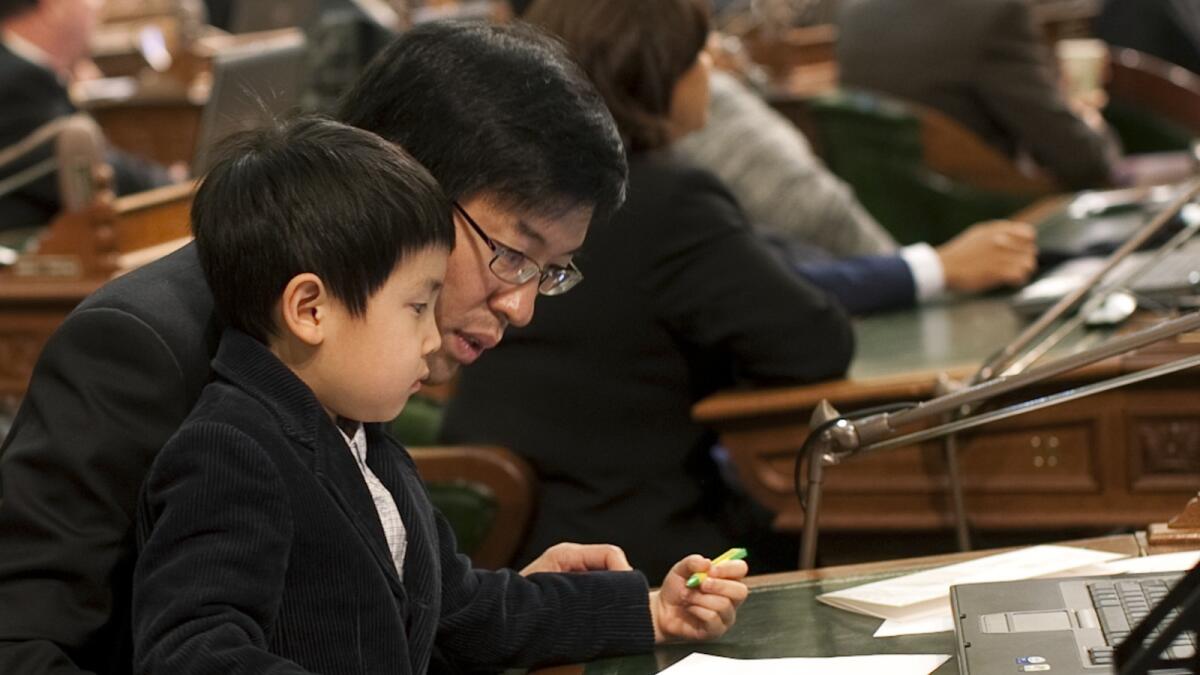 California Sen. Richard Pan, shown with his son William in 2010, says: "As a pediatrician, I have personally witnessed children suffering lifelong injury and death from vaccine-preventable infection."