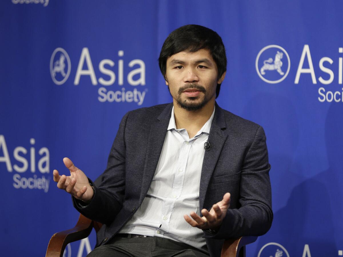 Manny Pacquiao takes questions at the Asia Society in New York on Oct. 12.