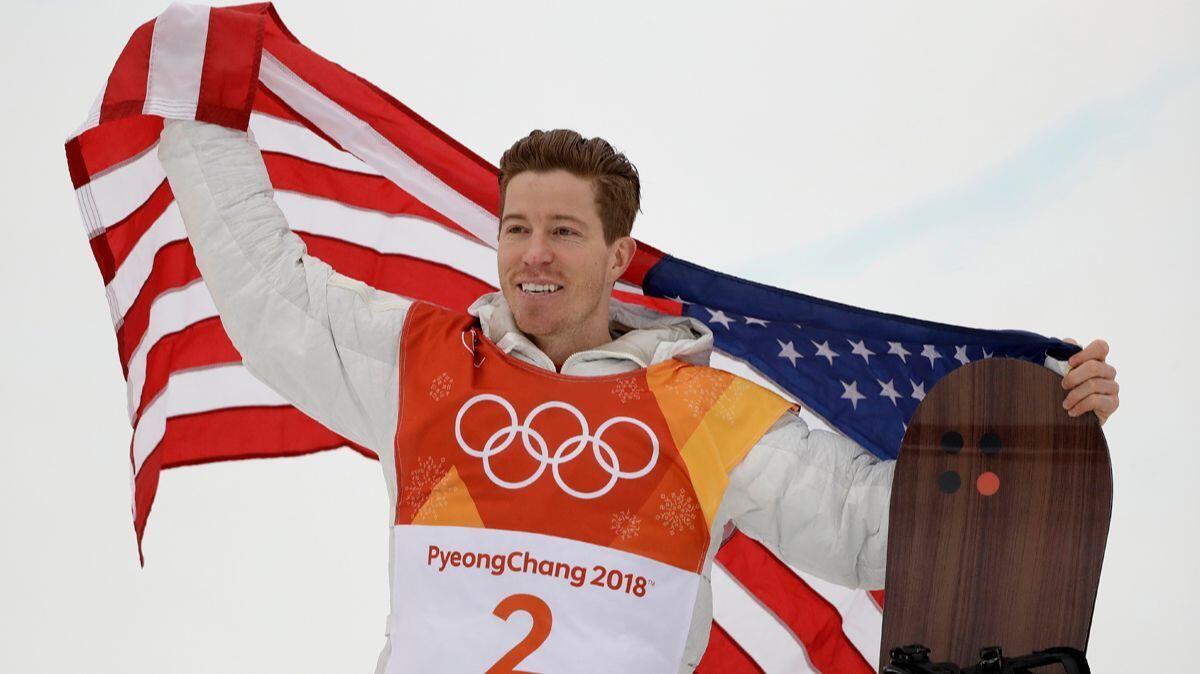 Shaun White celebrates his gold medal after the men's halfpipe finals at Phoenix Snow Park at the 2018 Winter Olympics in Pyeongchang, South Korea on Wednesday.