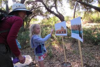 Poway residents Lisa Gymer and her daughter, Ava, 7, check out the storybook hike at Crestridge Ecological Reserve in Crest.
