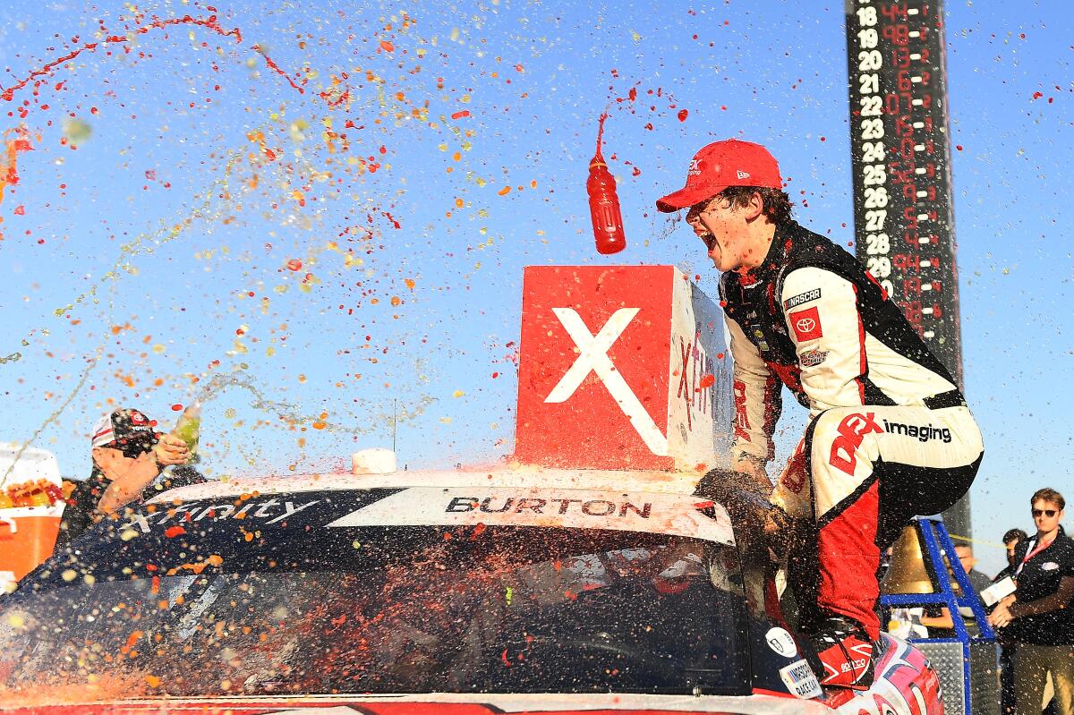 Harrison Burton celebrates his Xfinity Series victory in the Production Alliance Group 300 in Fontana on Feb. 29, 2020.