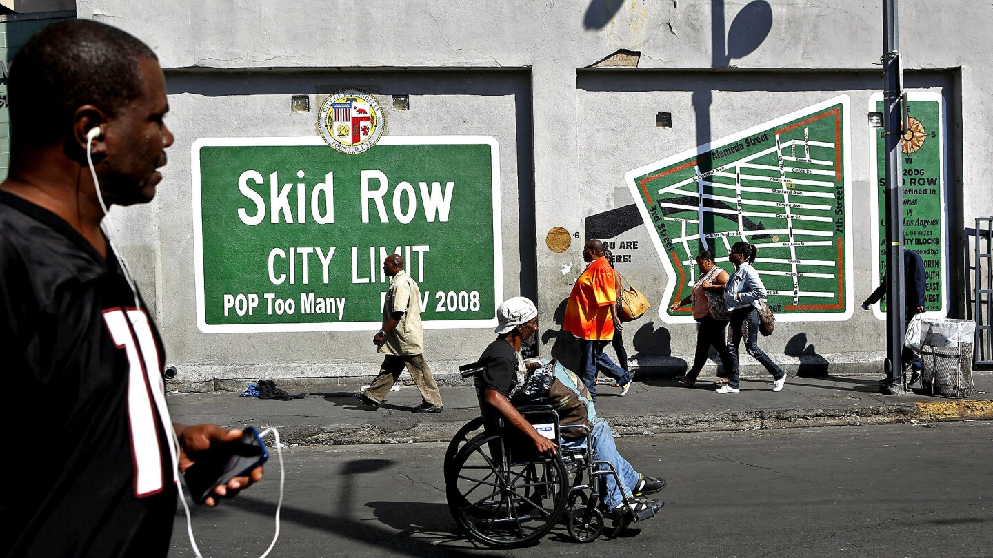 "The Skid Row Super Mural" on San Julian Street near 6th in the heart of the downtown area known as skid row "creates conversation and debate, which often great public art does," says Rick Coca, spokesman for City Councilman Jose Huizar.