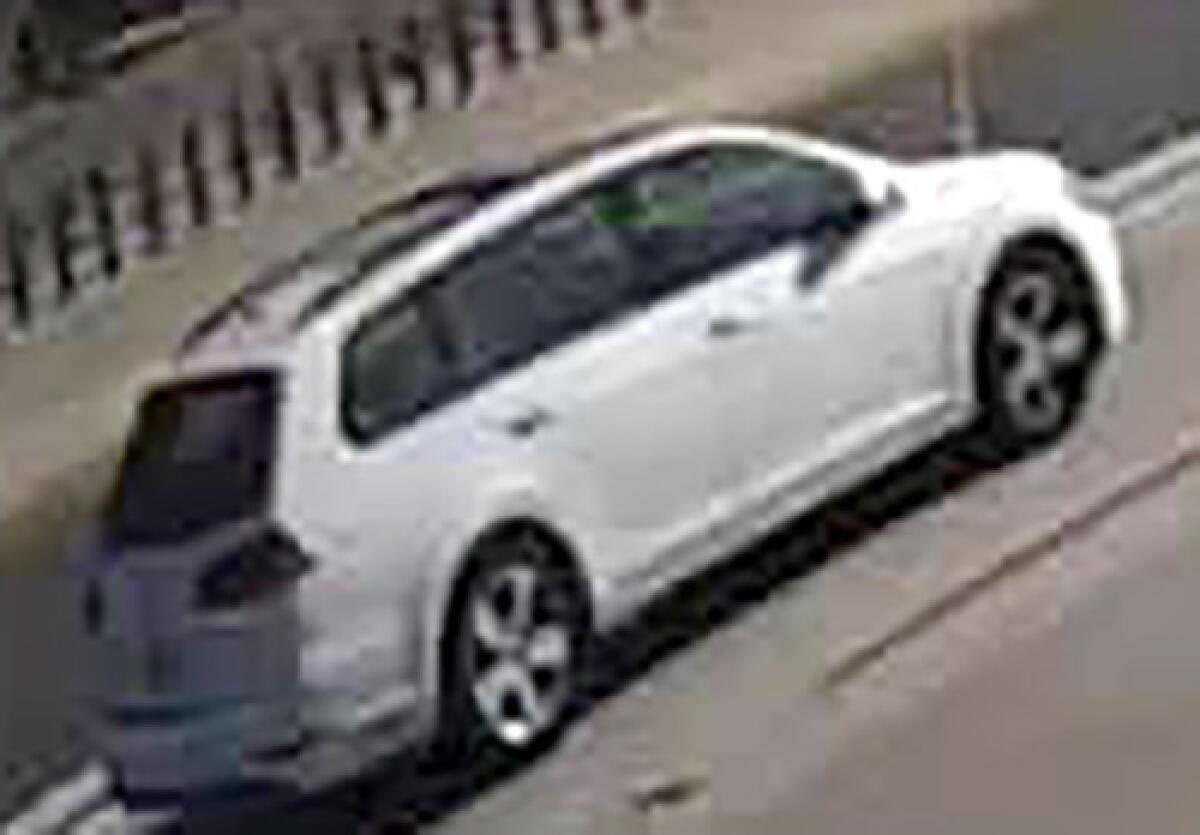 Dash cam image of a white Volkswagen station wagon.