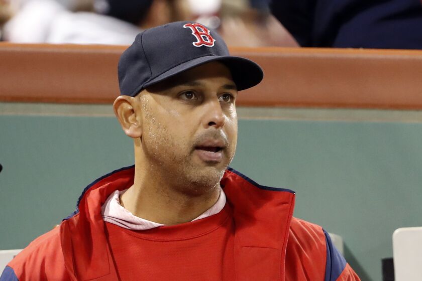Boston Red Sox manager Alex Cora in the dugout during the fifth inning of a baseball game against the Toronto Blue Jays, Thursday, April 11, 2019, at Fenway Park in Boston. (AP Photo/Winslow Townson)