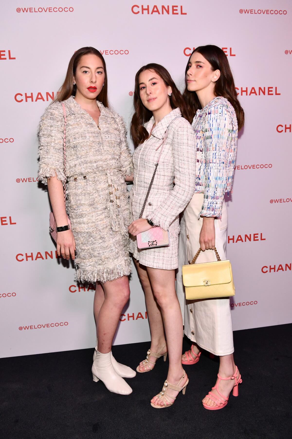 Este, left, Alana and Danielle Haim of Haim, all wearing Chanel, attend a private party at the Chanel Beauty House popup on Sunset Boulevard in West Hollywood.