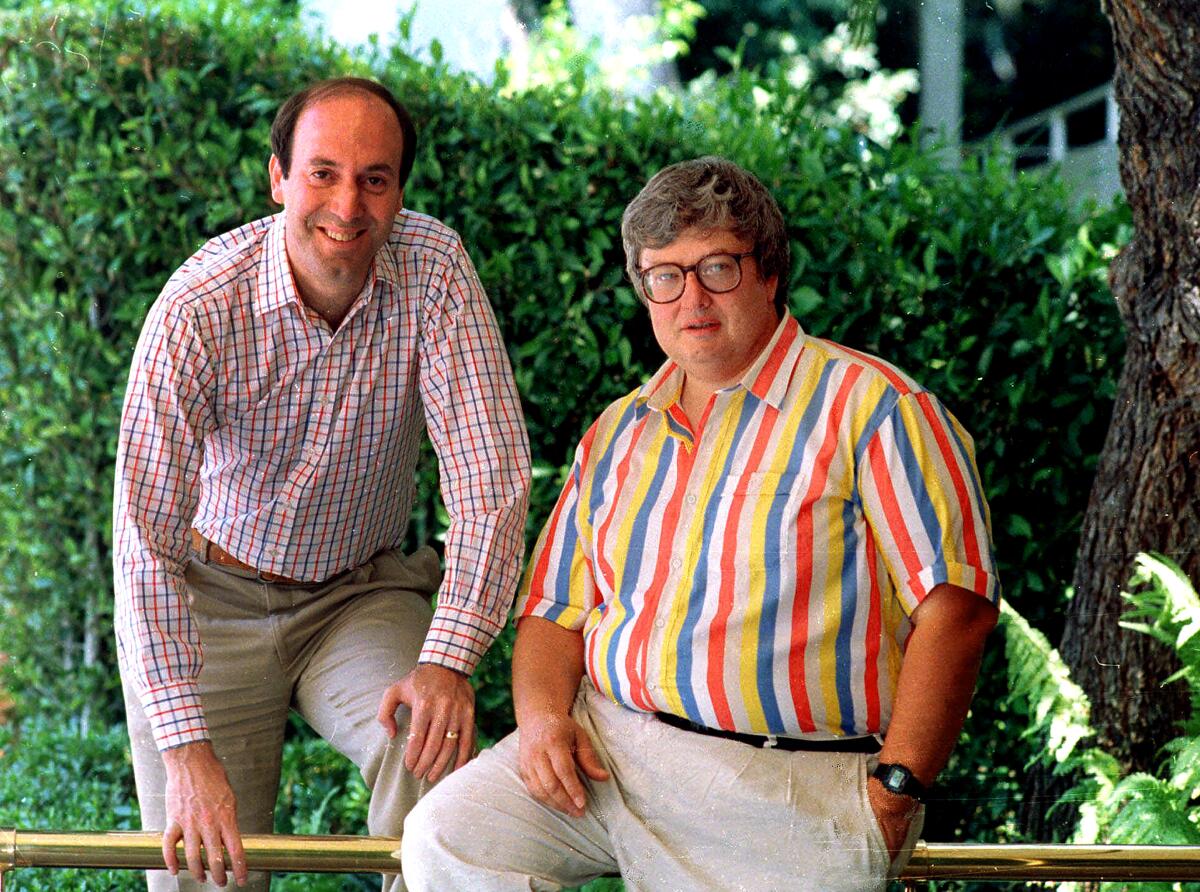 Gene Siskel poses with Roger Ebert in Los Angeles in 1986.