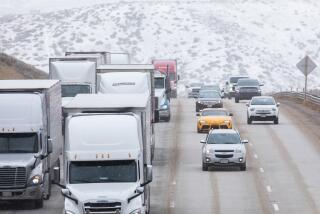 GORMAN, CA - JANUARY 30: Traffic on the 5 Freeway drives through a snowy landscape in Gorman on Monday, Jan. 30, 2023 in Gorman, CA. (Myung J. Chun / Los Angeles Times)