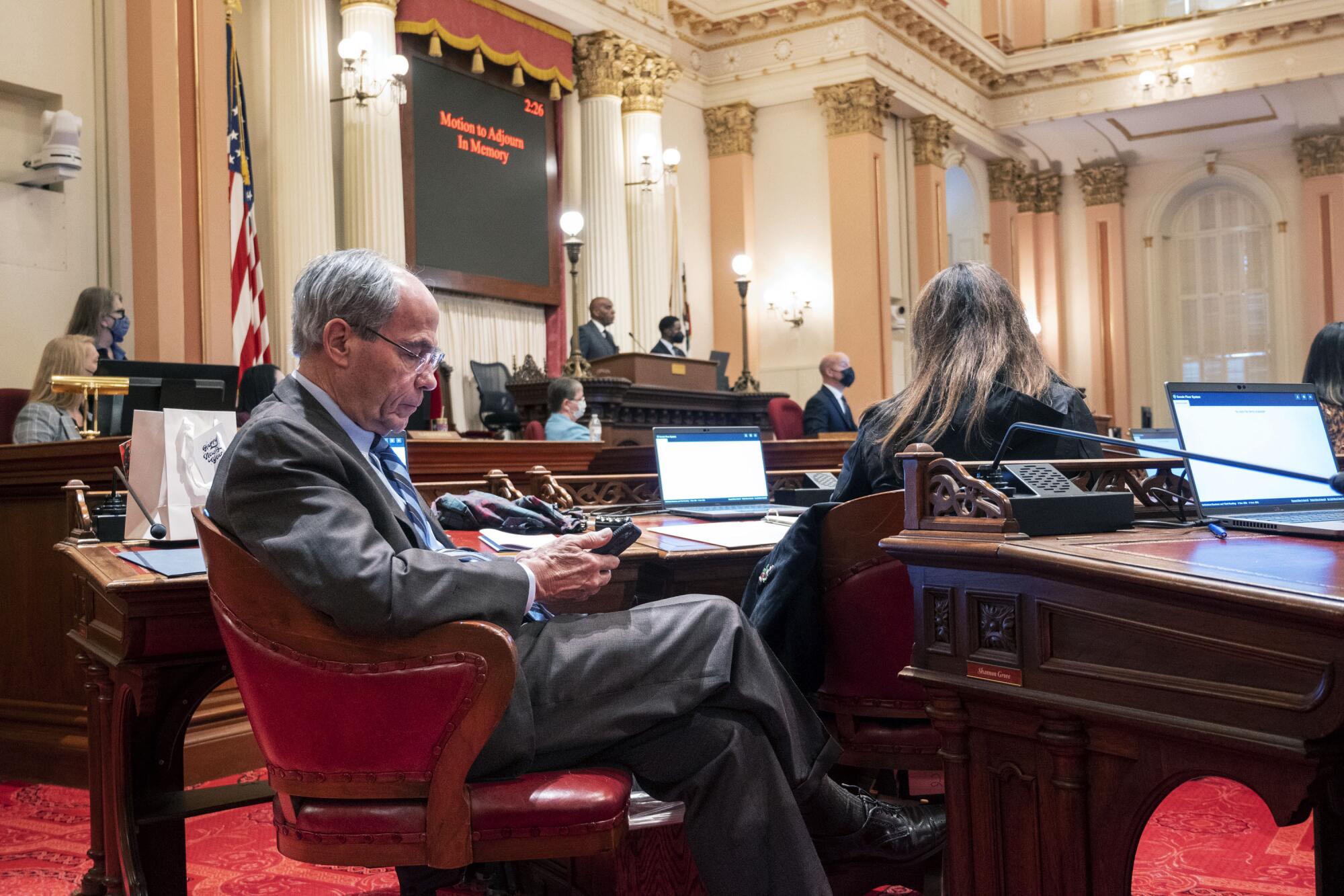 Sen. Roger Niello, a Republican from Fair Oaks, seated at his desk in the California Senate