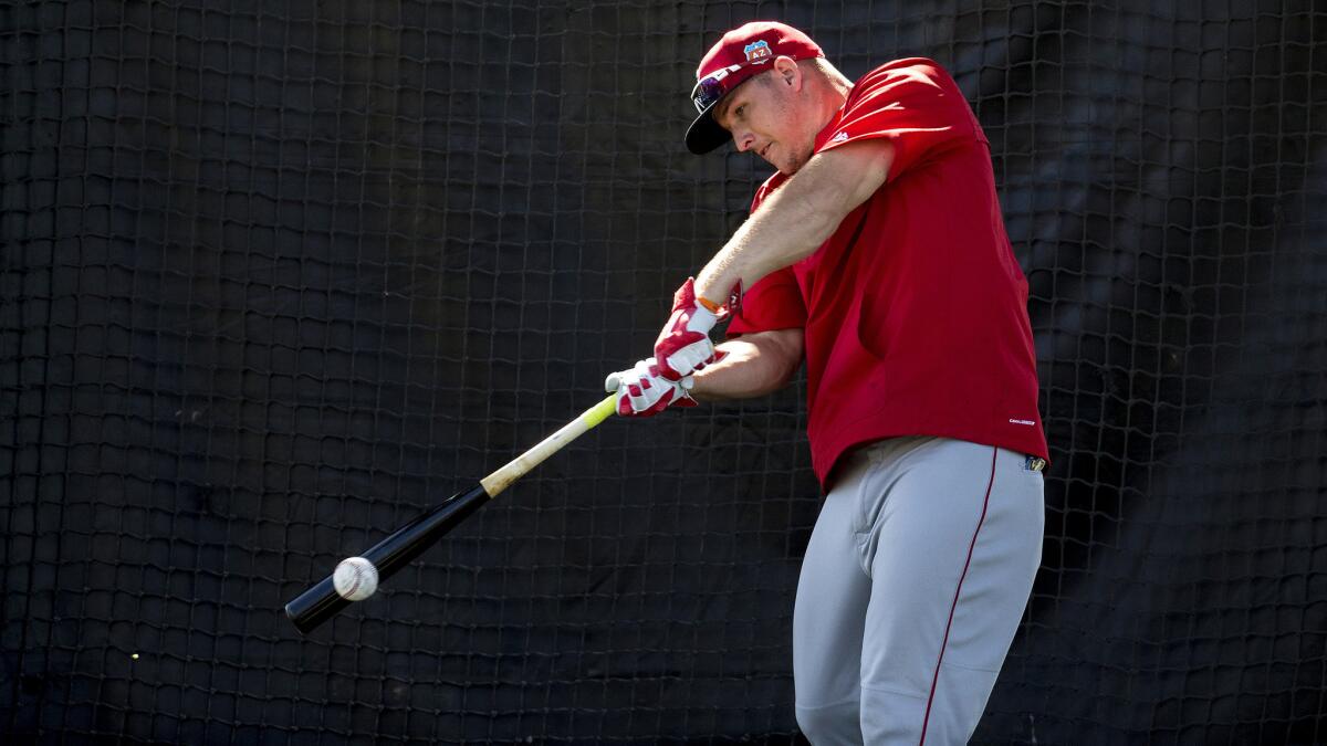 Angels center fielder Mike Trout takes batting practice during a spring training workout on Feb. 28.