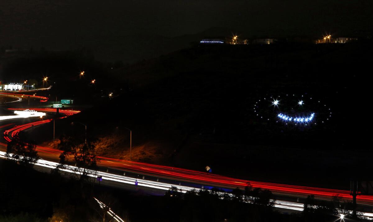 The 150-foot-wide smiley face on Happy Face Hill was created in 1998. Since then it's been something of a curiosity piece for motorists on the 118 Freeway.