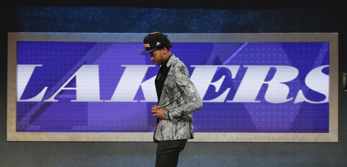 Brandon Ingram walks off stage after being selected as the second pick overall by the Lakers during the 2016 NBA draft.