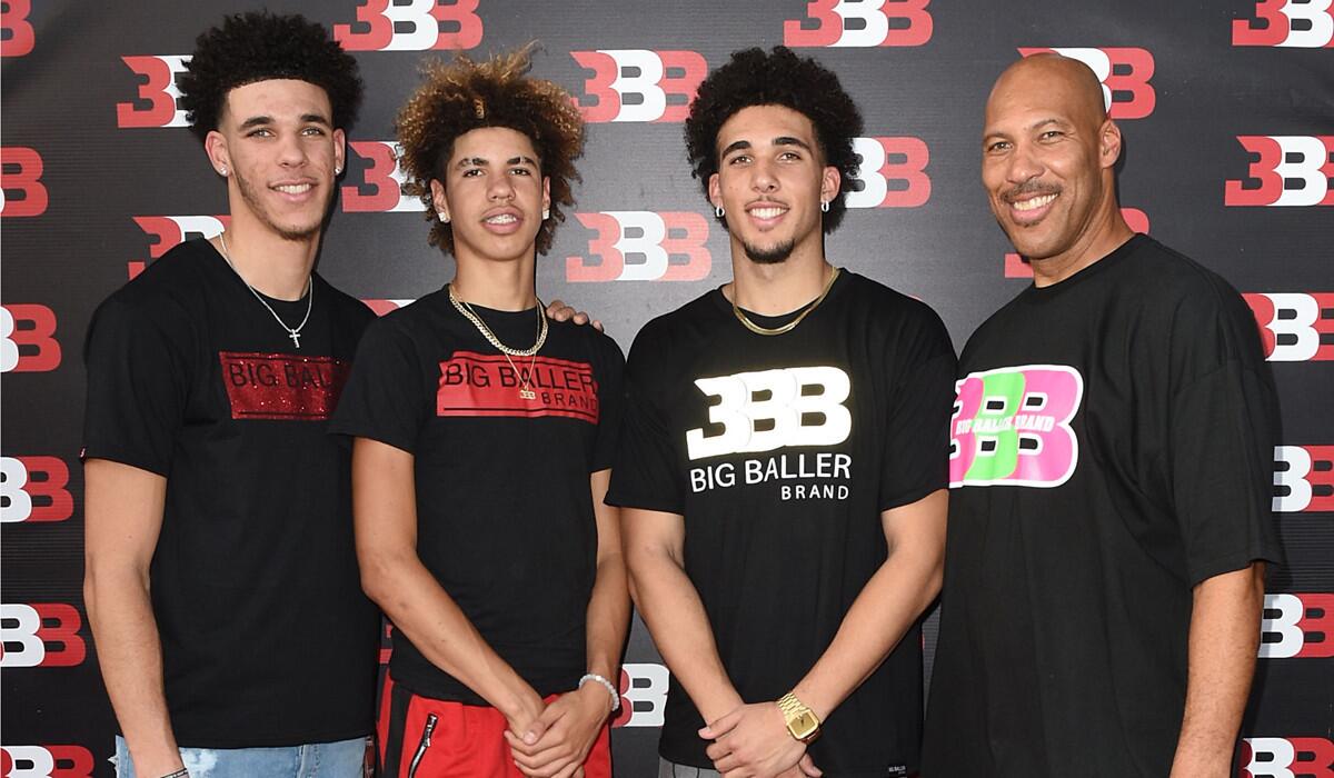 From left: Brothers Lonzo Ball, LaMelo Ball and LiAngelo Ball with dad LaVar Ball at LaMelo's 16th birthday party on Sept. 2 in Chino.