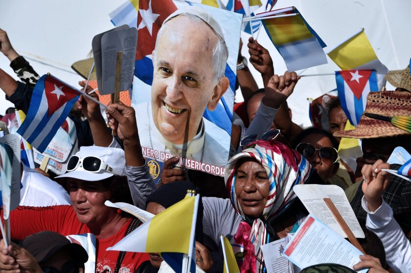 Crowds cheer as Pope Francis arrives Sept. 21 to celebrate Mass at Calixto Garcia Square in Holguin, Cuba.
