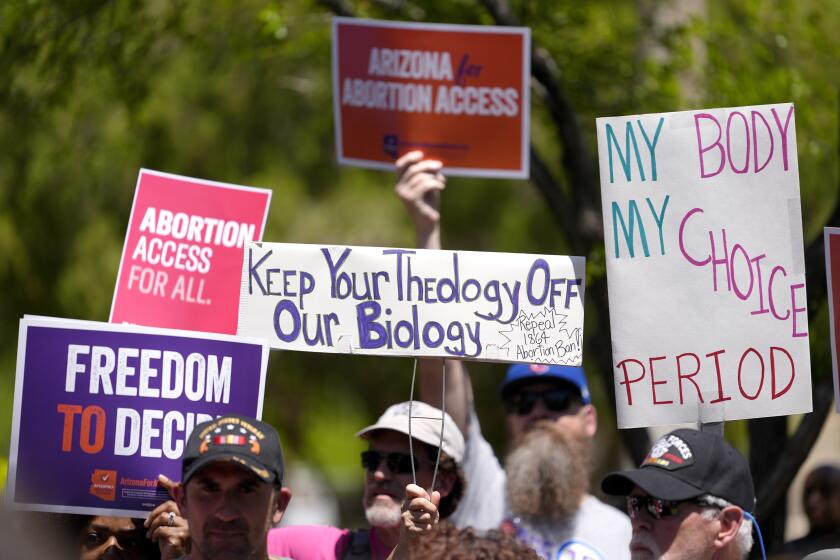 FILE - Abortion rights supporters gather outside the Capitol, Wednesday, April 17, 2024, in Phoenix. Arizona doctors could come to California and provide abortions for their patients under a new proposal announced Wednesday, April 24, 2024, by Gov. Gavin Newsom aimed at circumventing a state law that bans nearly all abortions in that state. (AP Photo/Matt York, File)