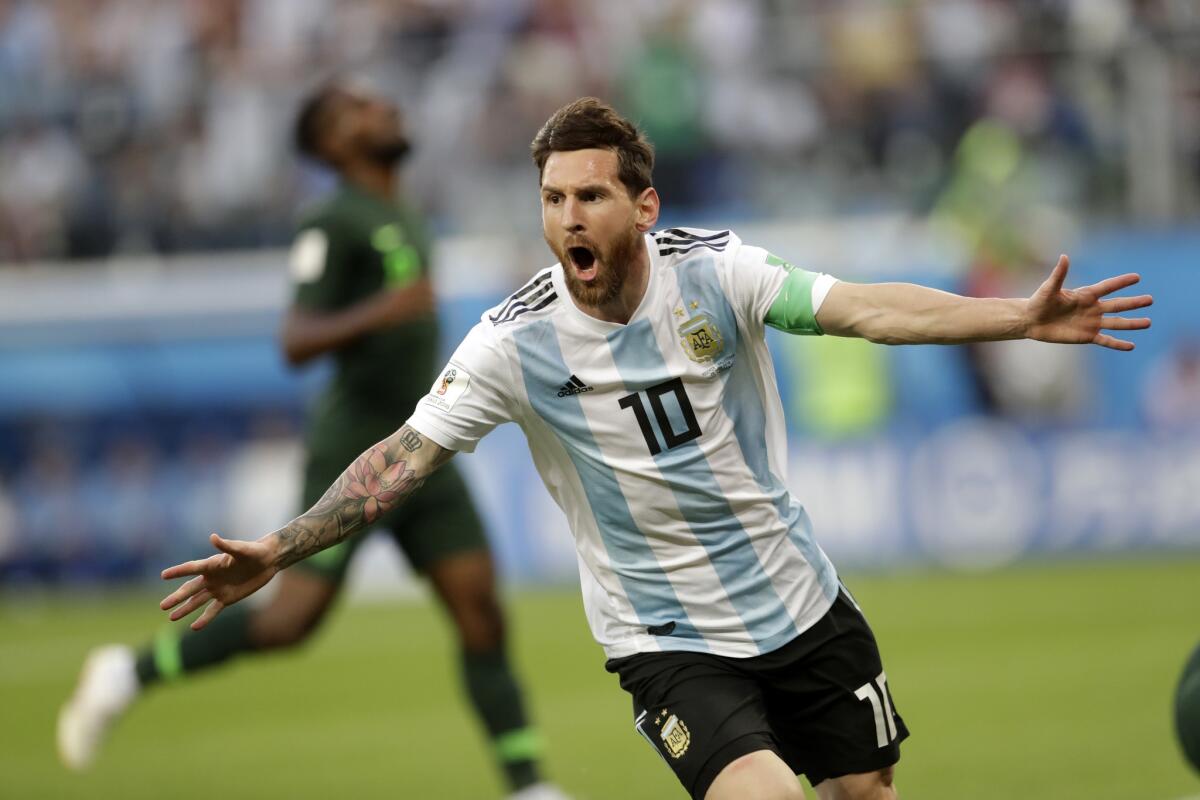 In this file photo from June 26, 2018, Argentina captain Lionel Messi celebrates after scoring the opening goal of his team during the Group D match between Argentina and Nigeria, at the 2018 World Cup in St. Petersburg, Russia.