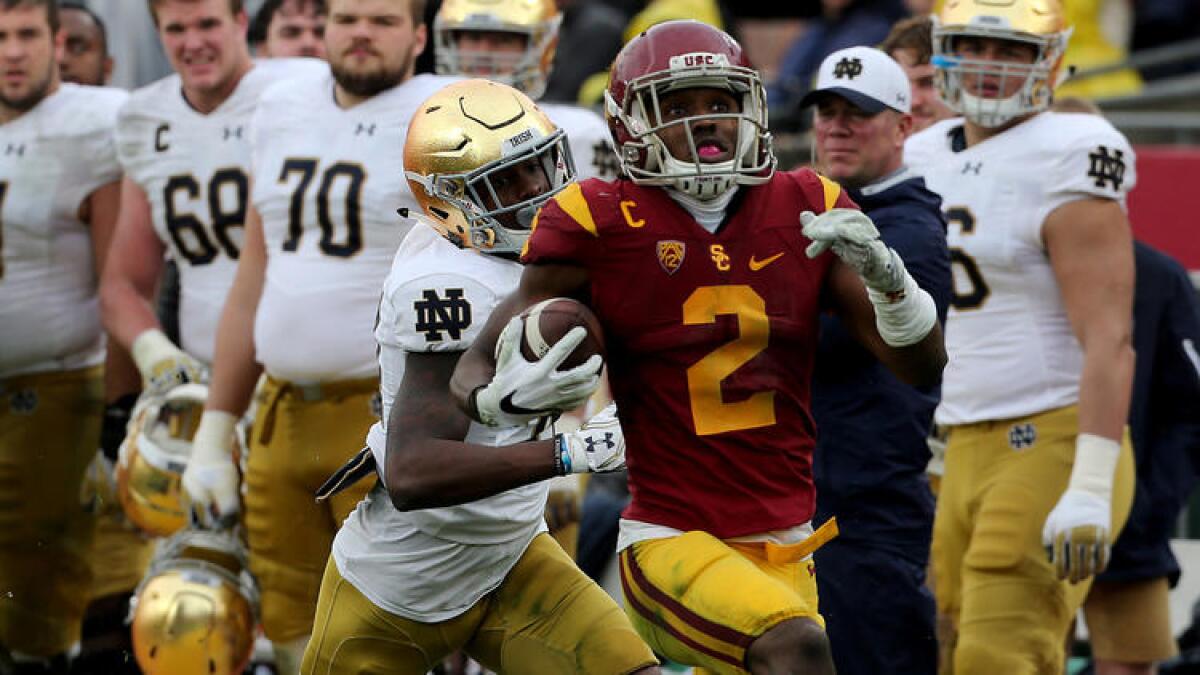 USC cornerback Adoree' Jackson returns a punt for a touchdown against Notre Dame in the third quarter Saturday. To see more images from the game, click on the photo above.