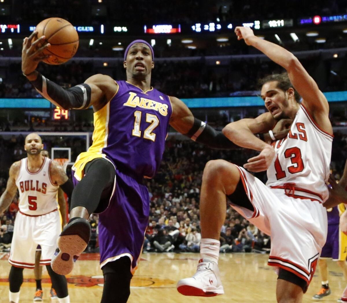 Lakers center Dwight Howard battles Bulls center Joakim Noah for a rebound during a game earlier this season.