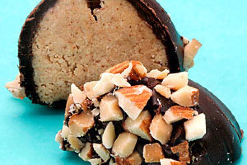 OVER EASY: Powdered milk is the secret ingredient that helps chocolate-dipped almond eggs keep their shape.