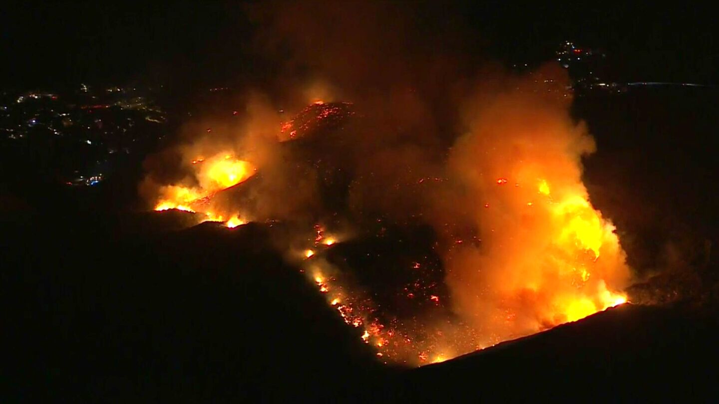 A brush fire burns inside Crystal Cove State Park in Laguna Beach.